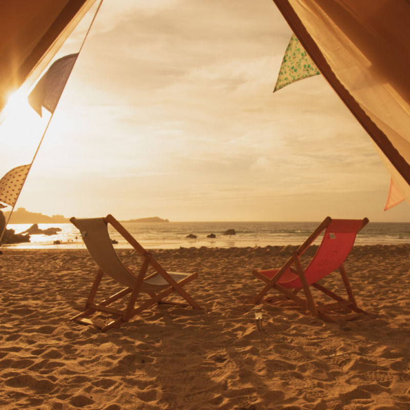 Sunset from glamping yurt at Lusty Glaze Beach, Cornwall.